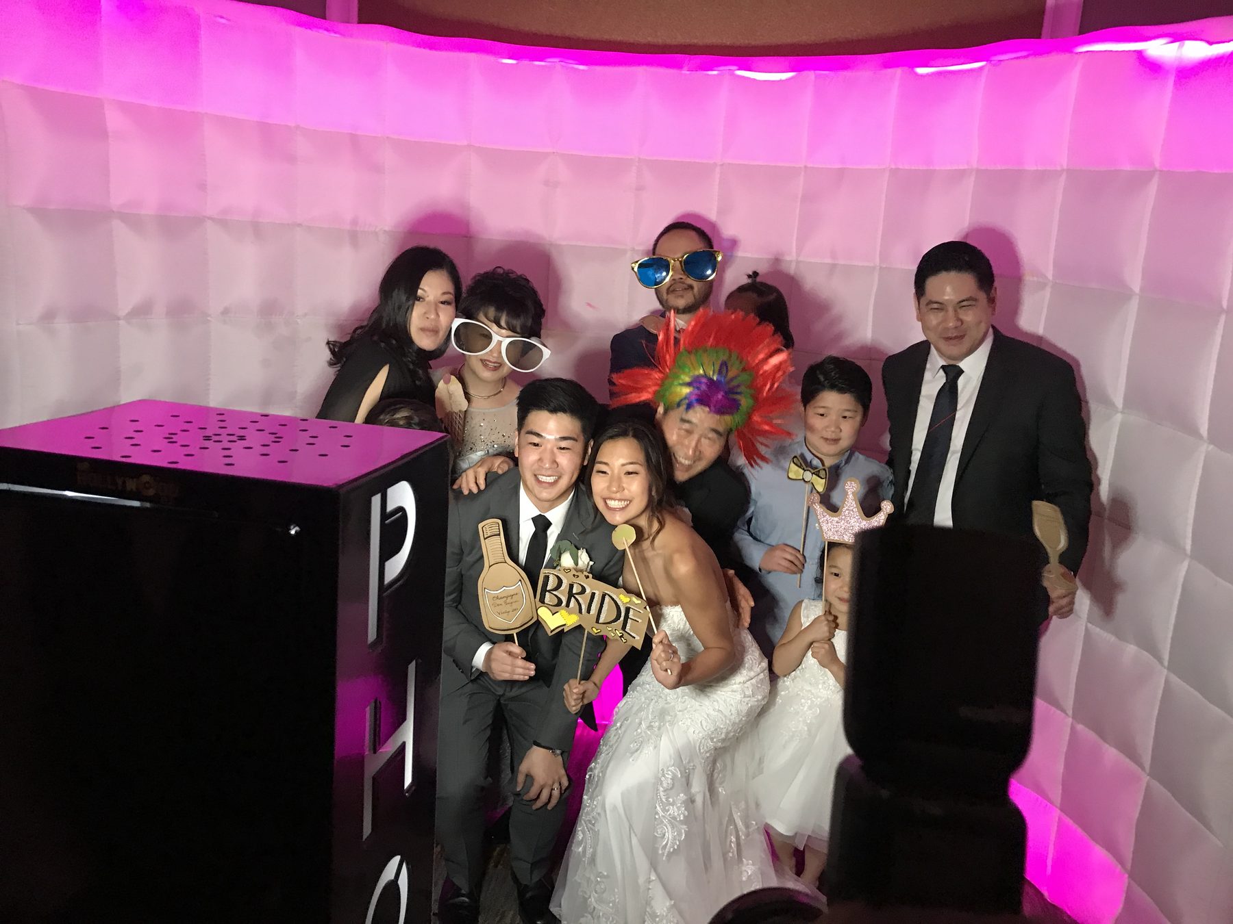 Guests enjoying a Hollywood Moments photo booth at a wedding